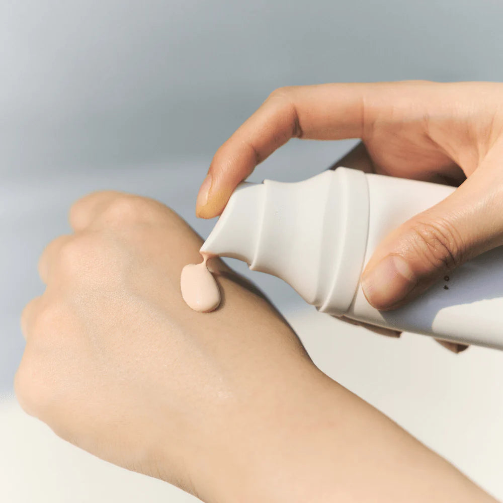 Écran solaire éclaircissant et unifiant le teint